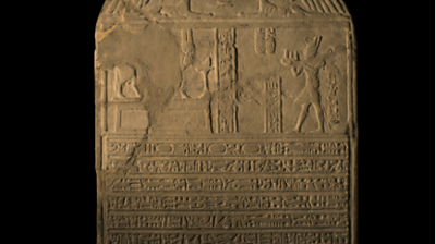 An ancient stone, embossed with ancient text 