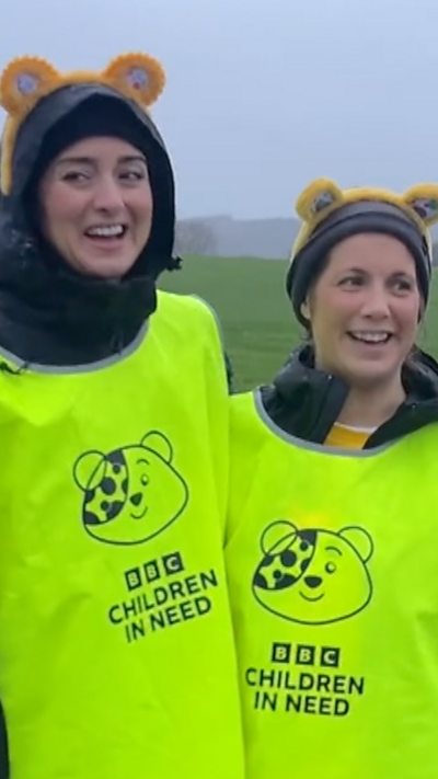 Amy Garcia and Lindsey Burrow stand next to each other wearing a high vis top with BBC Children in Need on it