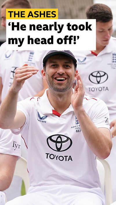 England cricketer Mark Wood smiling. He is wearing an England cricket top.