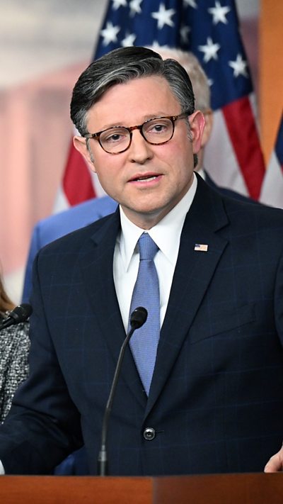 Mike Johnson is talking to the press.