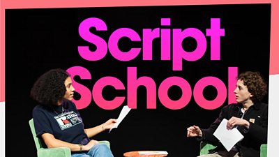 Two people seated on stage holding papers, with large pink text reading ‘Script School’ in the background