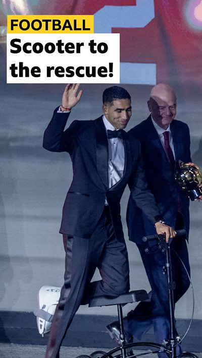 Comp image of Achraf Hakimi on a scooter collecting an award on stage. Headline text has been added.