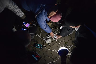 Ukrainians charging mobile devices