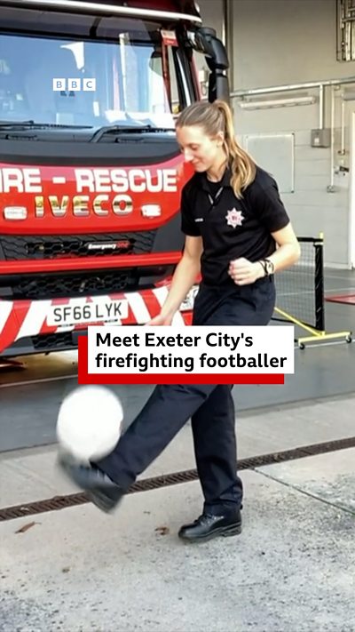 Firefighter doing a keepy up with a football