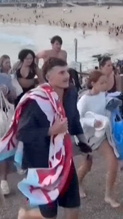 People running away from beach amidst gunshots