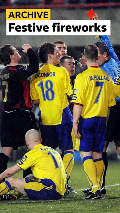 Referee Adrian McCourt issues a red card in the north Belfast derby in 2009