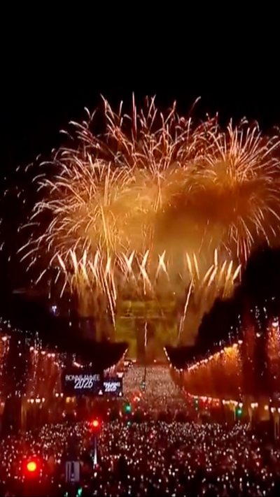 fireworks exploding above the Arc de Triomphe