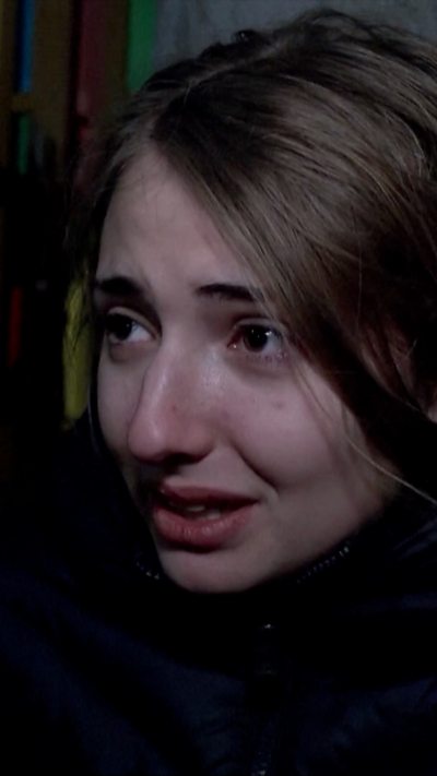 Female with long black hair and black outfit