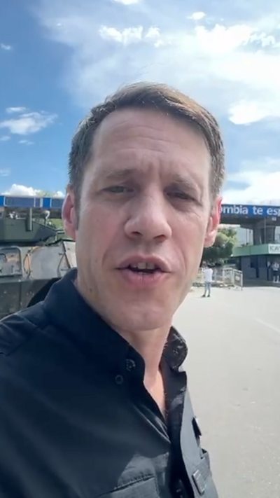 Man in front of a border crossing