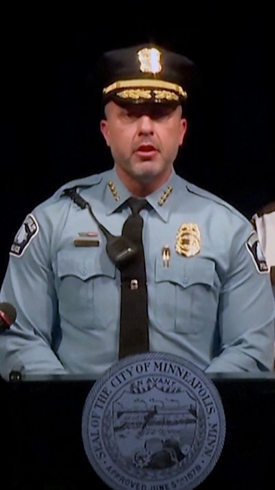 Police chief is talking to the camera.