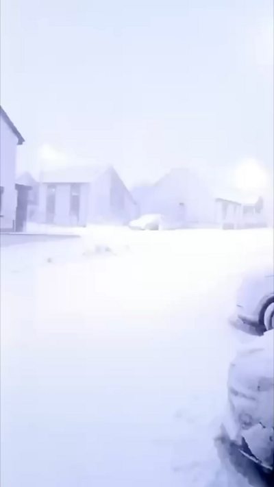 A flash in the sky over a snowy village