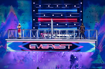 A raised platform with the word "Everest" shows a Gladiator and a Contender posing in the studio
