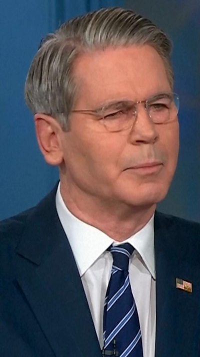 A man with grey hair in a suit.