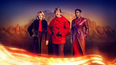 Three women - Hazel Irvine, Clare Balding and Jeanette Kwakye - stand in red and burgundy outfits, set against the backdrop of snowy mountains with a lick of flame across the foreground