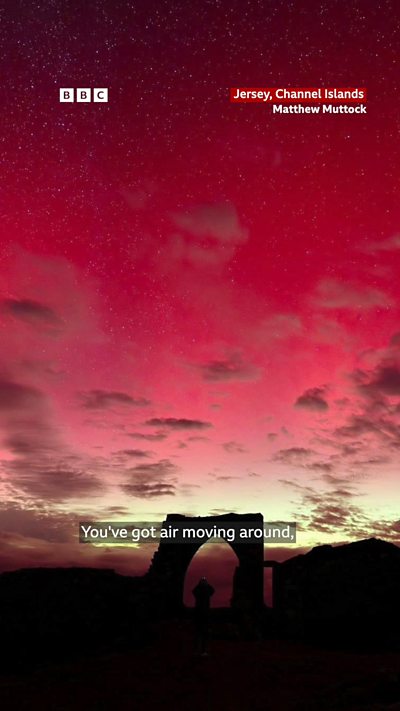 A still image showing the Northern Lights over Gronez Castle in Jersey