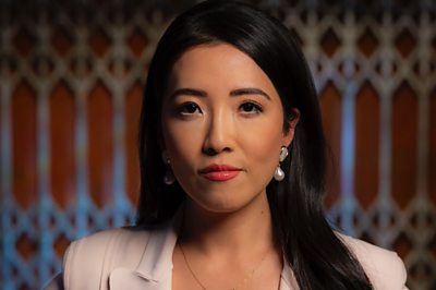 A woman (Susie Ma) poses for the camera.