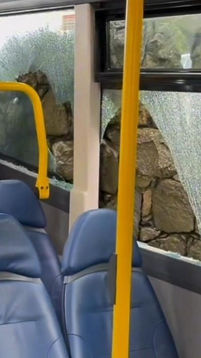 Windows of a bus in Guernsey smashed after scraping along a wall