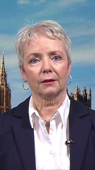 Karin Smyth wearing a white shirt and jacket