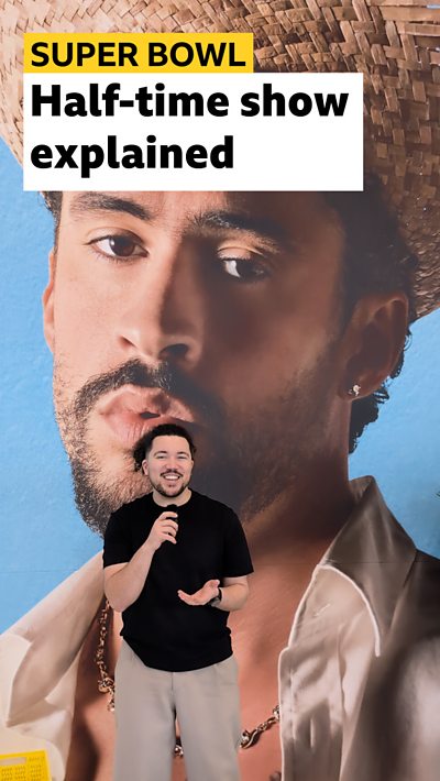 bbc sport reporter in front of picture of bad bunny