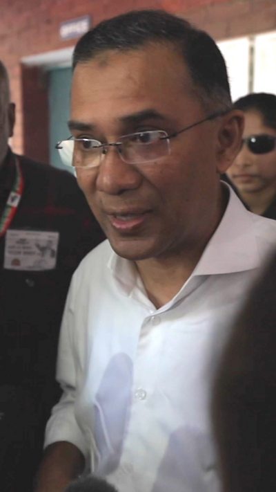 Leader of the Bangladesh Nationalist Party, Tarique Rahman, dressed in a white shirt speaking to camera