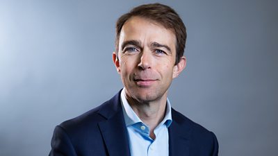 Photo of John Curbishley smiling to the camera.