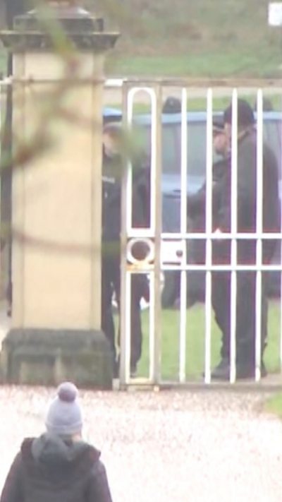 Officers at gates of Royal Lodge in Berkshire