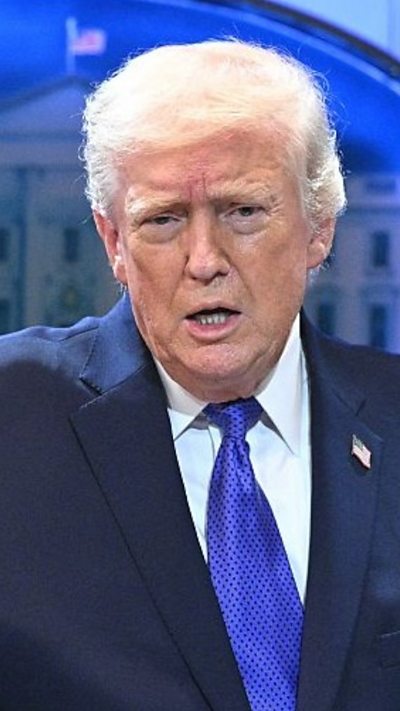 Donald Trump is talking to the press.