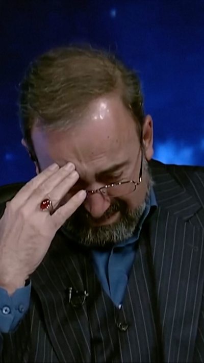 IRINN presenter with head in his hands