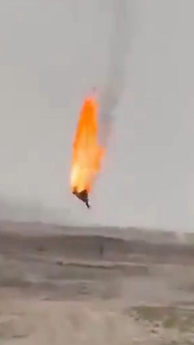 A flaming drone falling to the ground