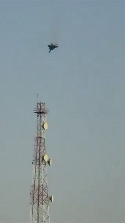 A fighter jet which looks to be falling out of the sky