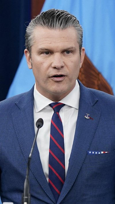 Hegseth speaking at press conference