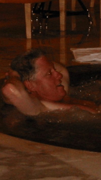 Bill Clinton is seen in the hot tub.