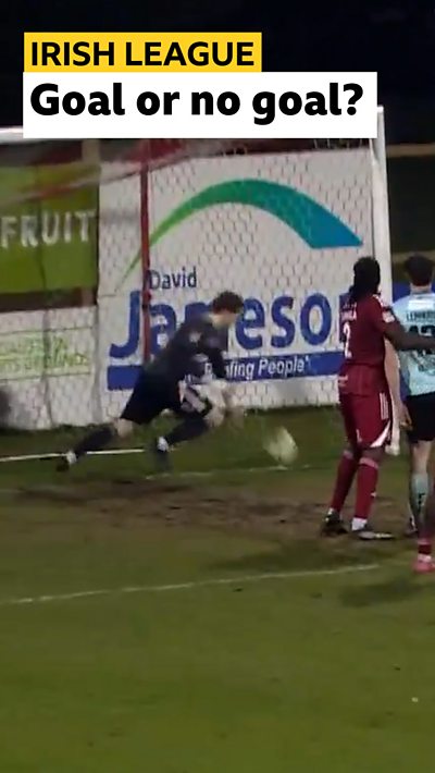 Alex Moore scrambles to clear the ball off his line