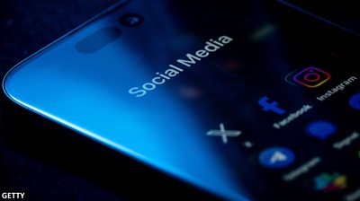 A phone showing social media icons