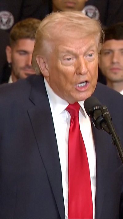 Trump wearing a bright red tie