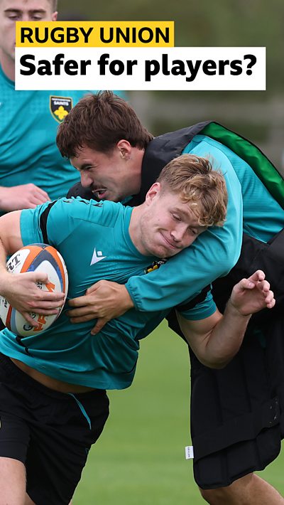 Fin Smith is tackled during the Northampton Saints training session