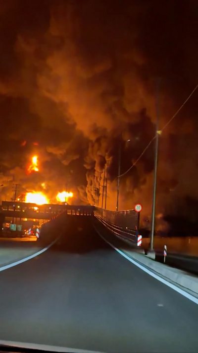 Flames in sky above road in Tehran