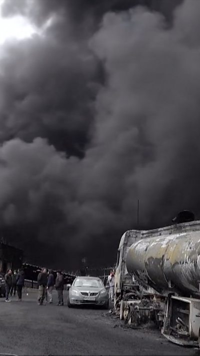 Thick black smoke billows into air