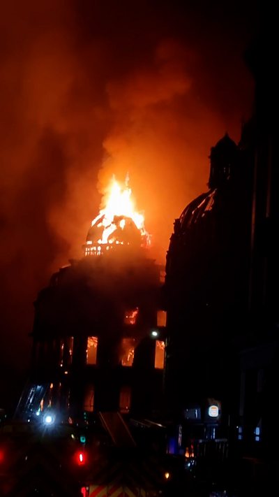 Forsyth building dome on fire at night