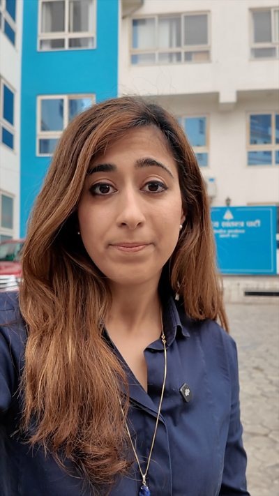 Azadeh Moshiri stands in front of the RSP headquarters.