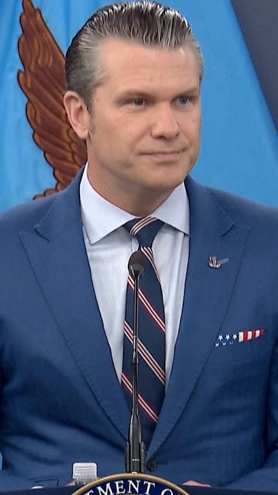 Pete Hegseth is talking to the press.