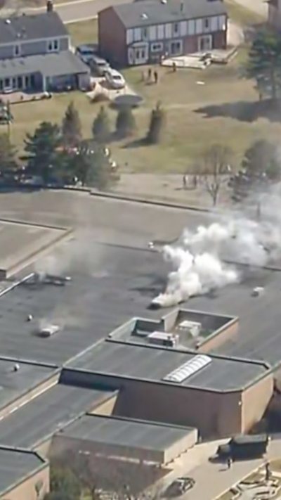 Smoke is seen coming from building.