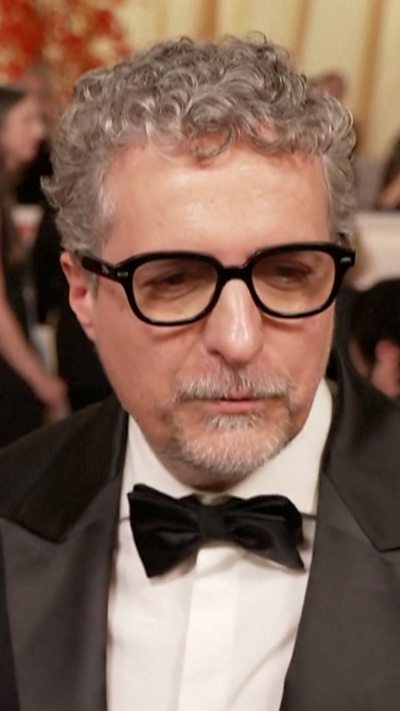 Kleber Mendonça Filho is talking to the press.