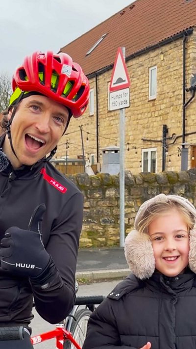 Greg James and Mia give a thumbs up to the camera