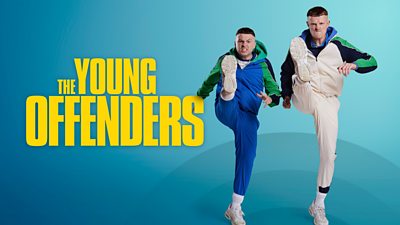 Key art for The Young Offenders series five, featuring characters Conor and Jock kicking the air angrily. 