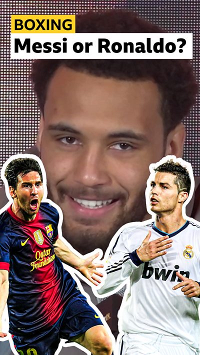 Boxer Moses Itauma smiling. There is a cut-out of Lionel Messi to the left and a cut-out of Cristiano Ronaldo to the right