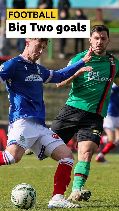 Action from Glentoran against Linfield at The Oval