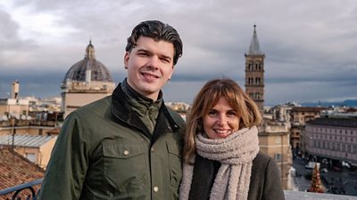 Harry and his mum, Georgia, stand in front of a view of Rome.