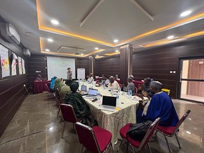 Becky Palmstrom speaking with cultural leaders from Northern Nigeria in workshop