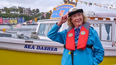 Edie Mc Credie by her boat